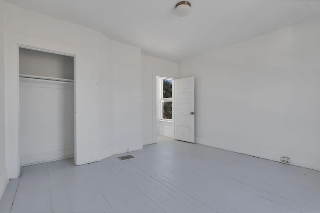 unfurnished bedroom with a closet