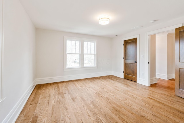 unfurnished bedroom with light wood-type flooring