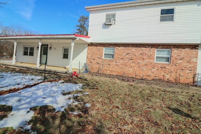 snow covered property featuring cooling unit