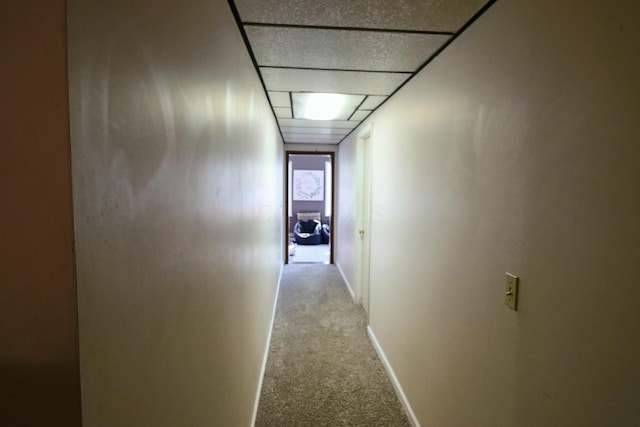 hallway with light colored carpet