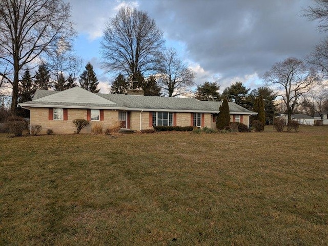 ranch-style home with a front yard