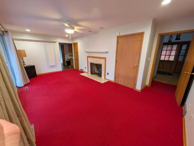 living room featuring carpet floors and ceiling fan