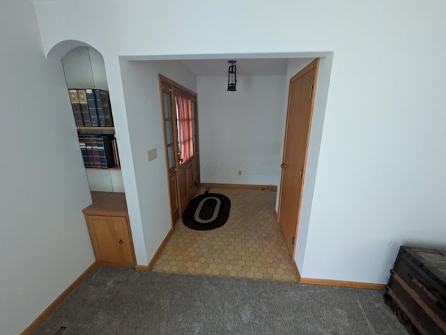 corridor with light colored carpet