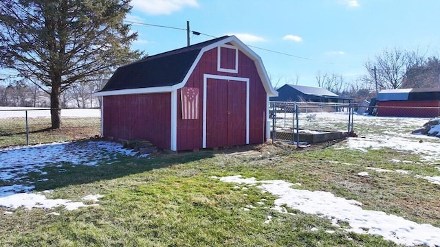 view of outdoor structure featuring a lawn