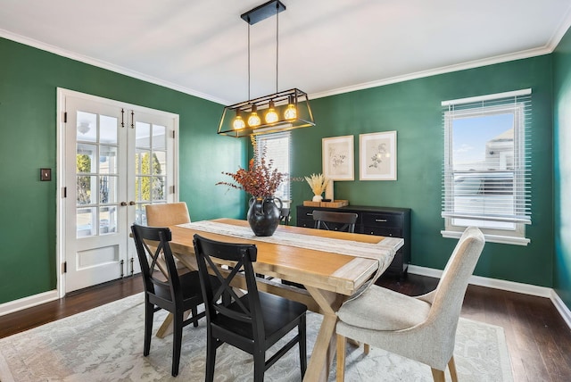 dining room with french doors, ornamental molding, plenty of natural light, and dark hardwood / wood-style floors