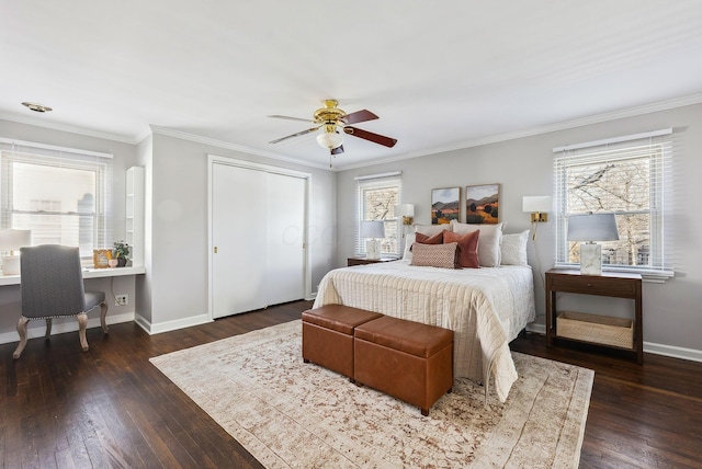 bedroom with multiple windows, dark hardwood / wood-style flooring, crown molding, and ceiling fan