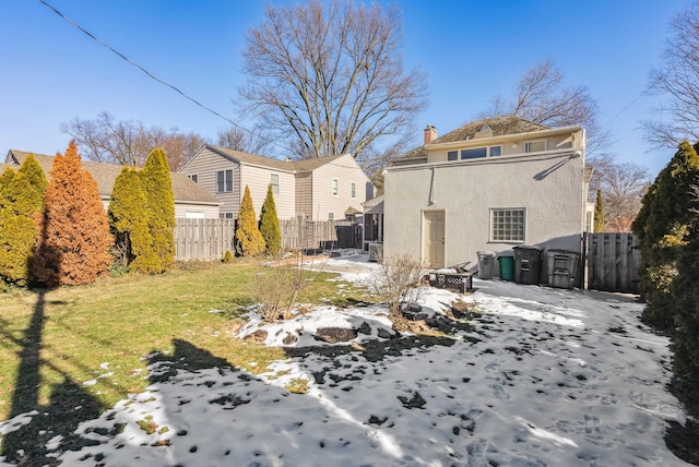 rear view of house with a lawn