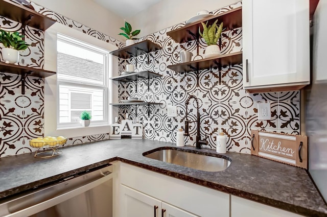 kitchen with white cabinetry, dishwasher, and a wealth of natural light