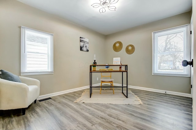 office with hardwood / wood-style flooring