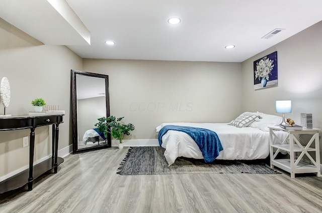 bedroom with light wood-type flooring