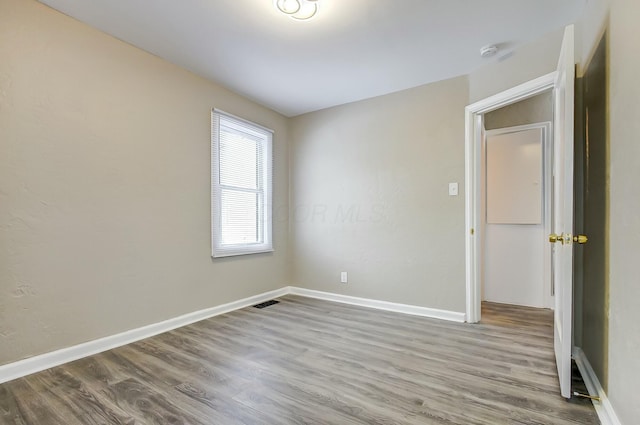 unfurnished room featuring light hardwood / wood-style flooring