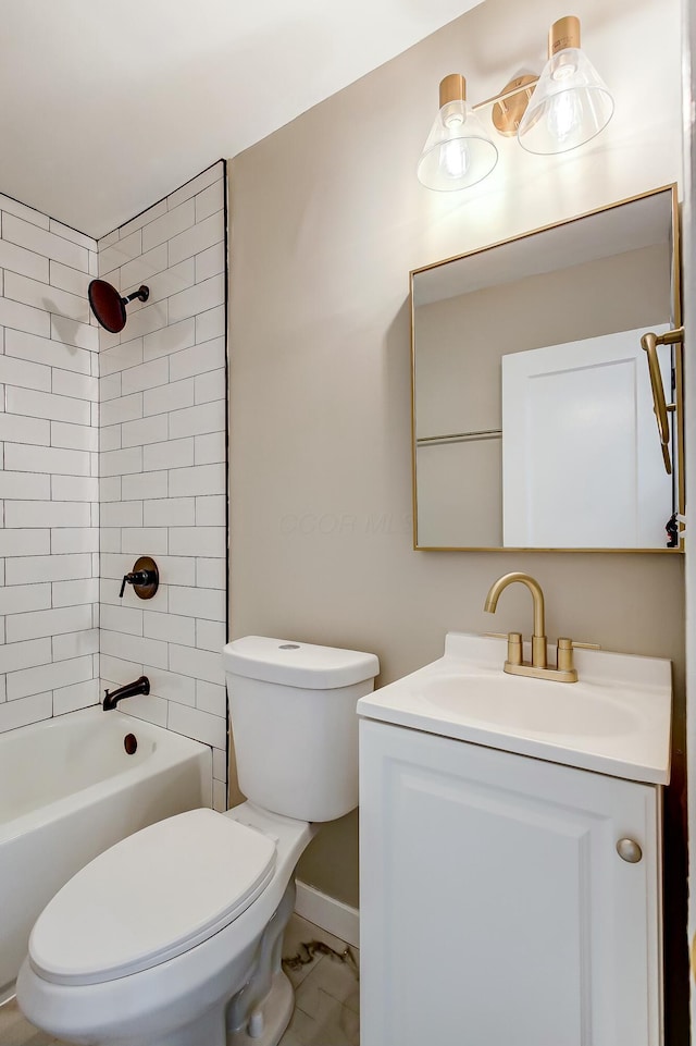 full bathroom with tiled shower / bath, vanity, and toilet