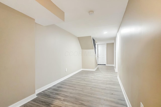 hall with hardwood / wood-style floors