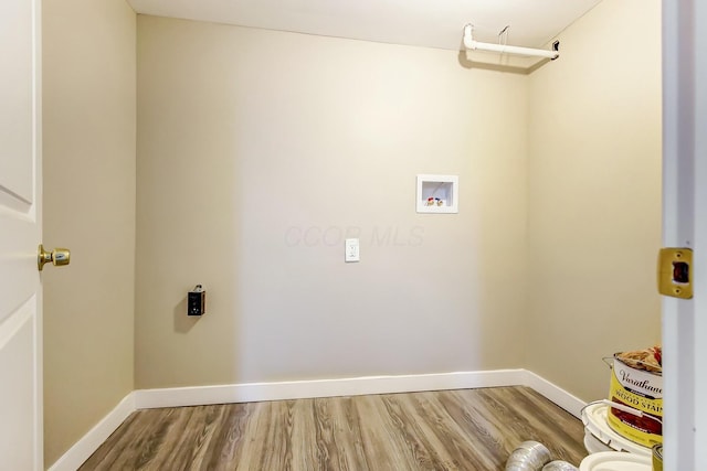 washroom with hookup for a washing machine, hardwood / wood-style floors, and hookup for an electric dryer