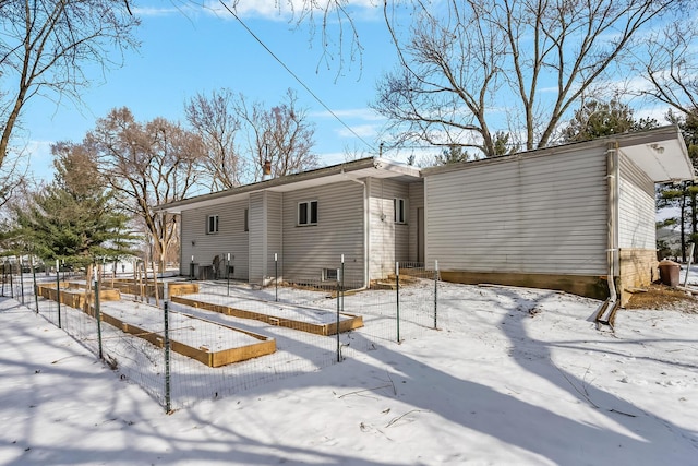 view of snow covered house