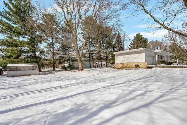 view of yard layered in snow