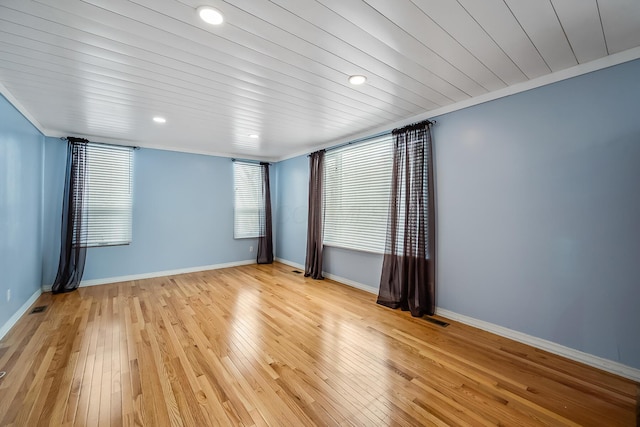 unfurnished room with ornamental molding, wooden ceiling, and light hardwood / wood-style flooring