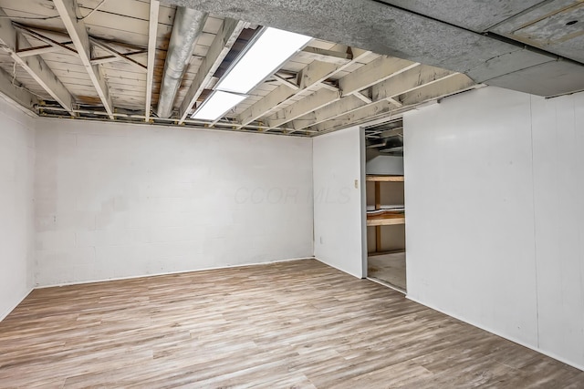 basement with wood-type flooring