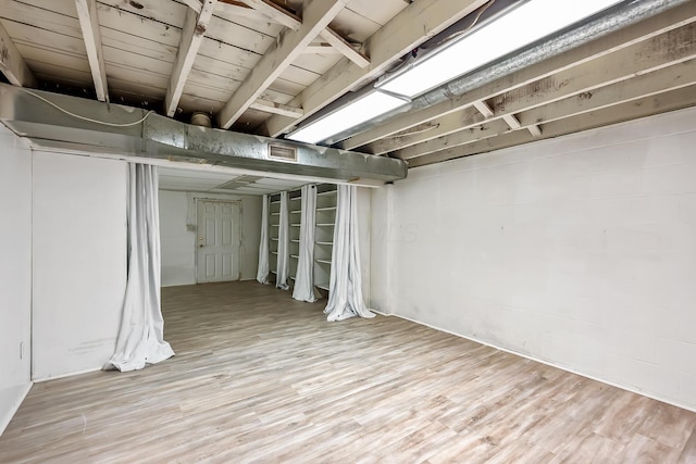 basement with light wood-type flooring