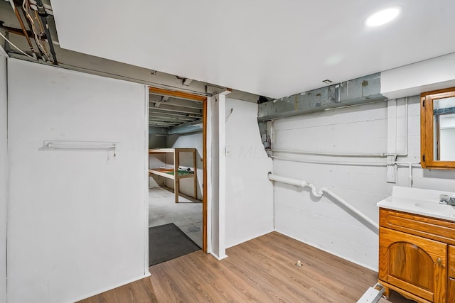 bathroom with hardwood / wood-style flooring and vanity