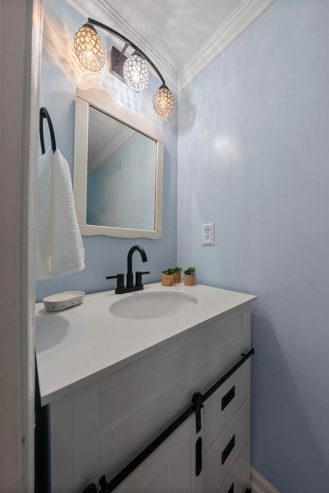 bathroom with crown molding and vanity