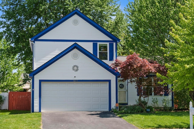 view of front of house with a garage and a front yard