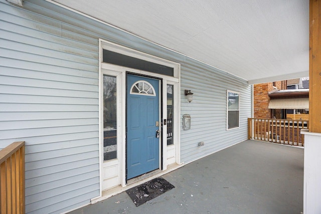 doorway to property with covered porch