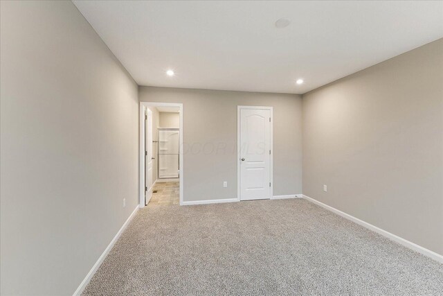 1221 Heathgate Way, Fairborn, OH 45324 - unfurnished bedroom featuring light colored carpet, baseboards, recessed lighting, and ensuite bath