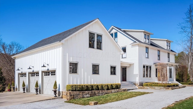 modern farmhouse style home featuring board and batten siding and driveway