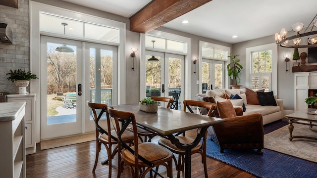 sunroom with beamed ceiling, french doors, a chandelier, and a healthy amount of sunlight