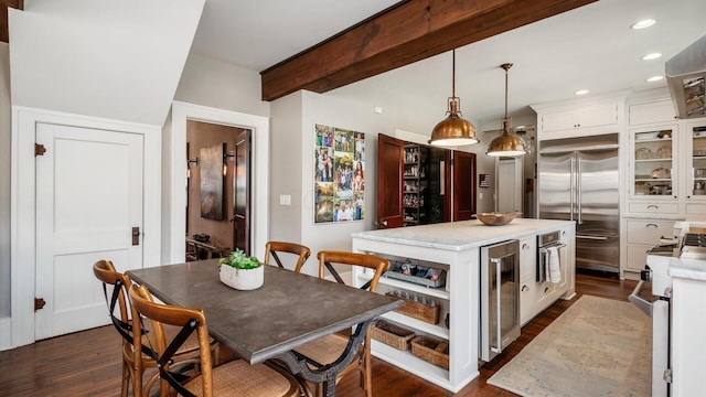 kitchen with high quality appliances, open shelves, a center island, wine cooler, and white cabinets