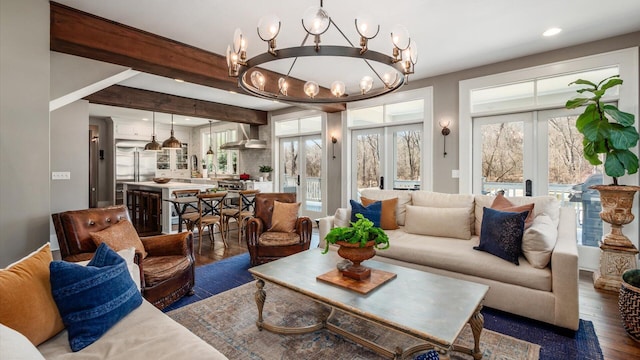 living room featuring wood finished floors, recessed lighting, french doors, beamed ceiling, and a notable chandelier