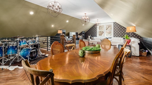 dining space with lofted ceiling and a notable chandelier