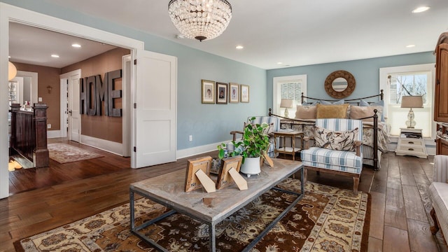 sitting room with a wealth of natural light, baseboards, recessed lighting, and hardwood / wood-style flooring