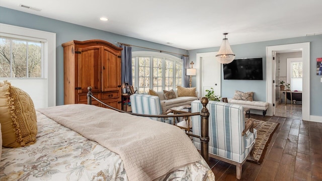 bedroom featuring dark wood-type flooring, recessed lighting, baseboards, and visible vents