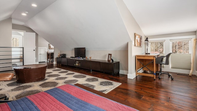 bedroom featuring vaulted ceiling, multiple windows, baseboards, and wood-type flooring