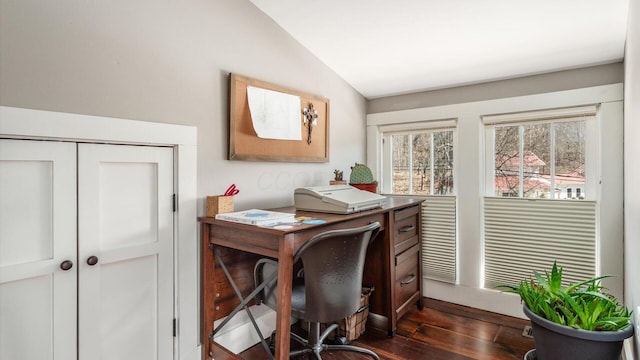 office space with dark wood-type flooring and vaulted ceiling