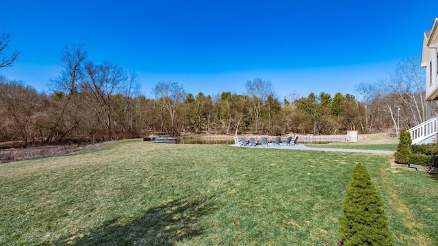 view of yard featuring a view of trees