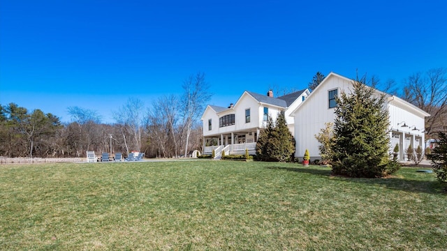 view of property exterior with a yard and a porch