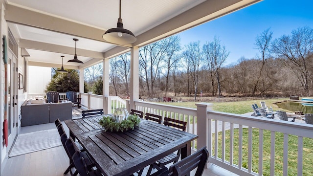 exterior space with a lawn, an outdoor hangout area, and ceiling fan