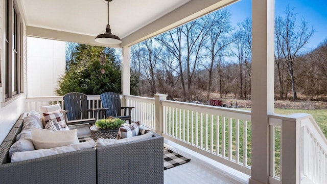 wooden deck with a ceiling fan