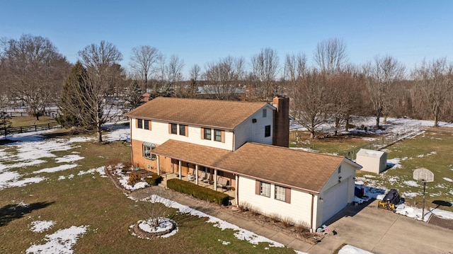 view of front of house featuring a garage and a porch