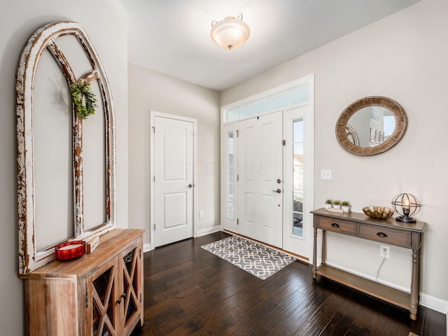 entrance foyer featuring dark hardwood / wood-style floors