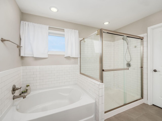 bathroom featuring plus walk in shower