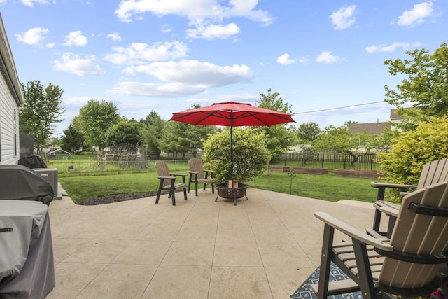 view of patio featuring a grill and a fire pit