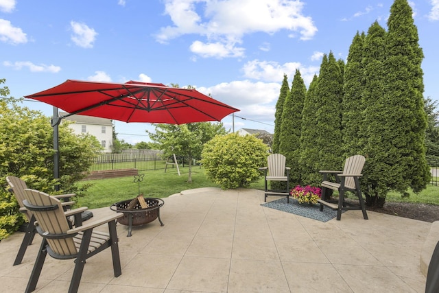 view of patio / terrace with an outdoor fire pit