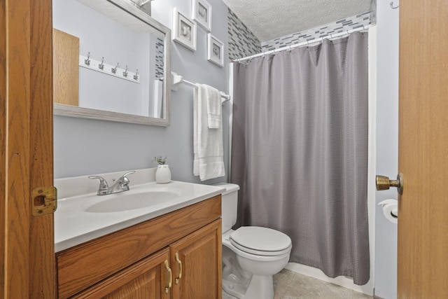 bathroom with vanity, toilet, tile patterned floors, a textured ceiling, and a shower with shower curtain