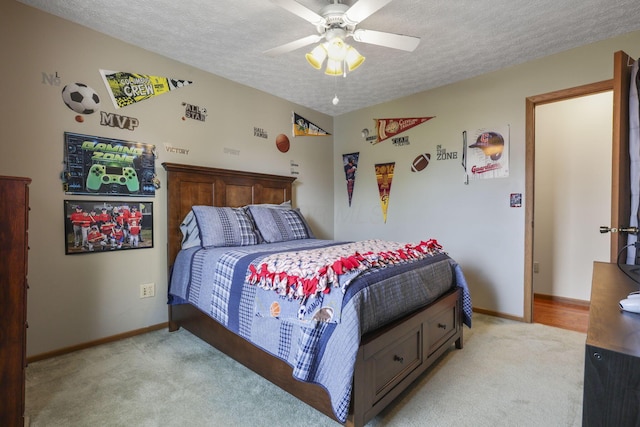 carpeted bedroom with ceiling fan, lofted ceiling, and a textured ceiling