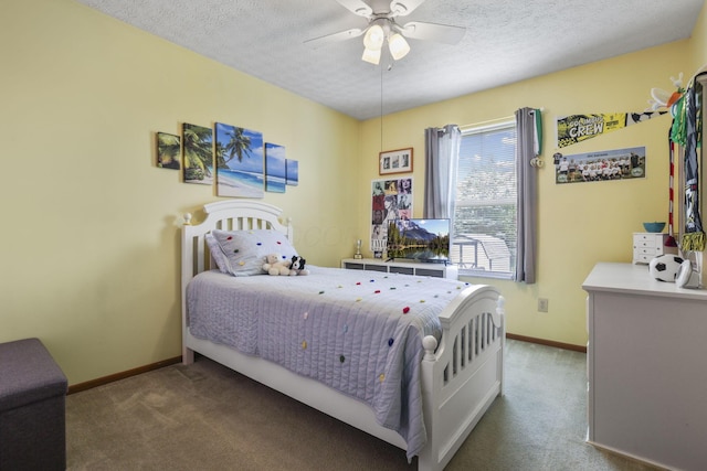 bedroom with a textured ceiling, ceiling fan, and carpet flooring