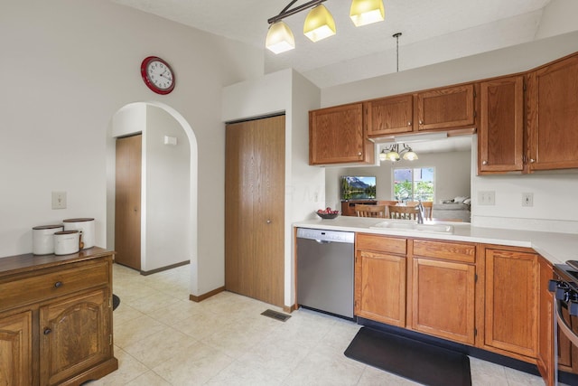 kitchen with stainless steel dishwasher, range, sink, and hanging light fixtures